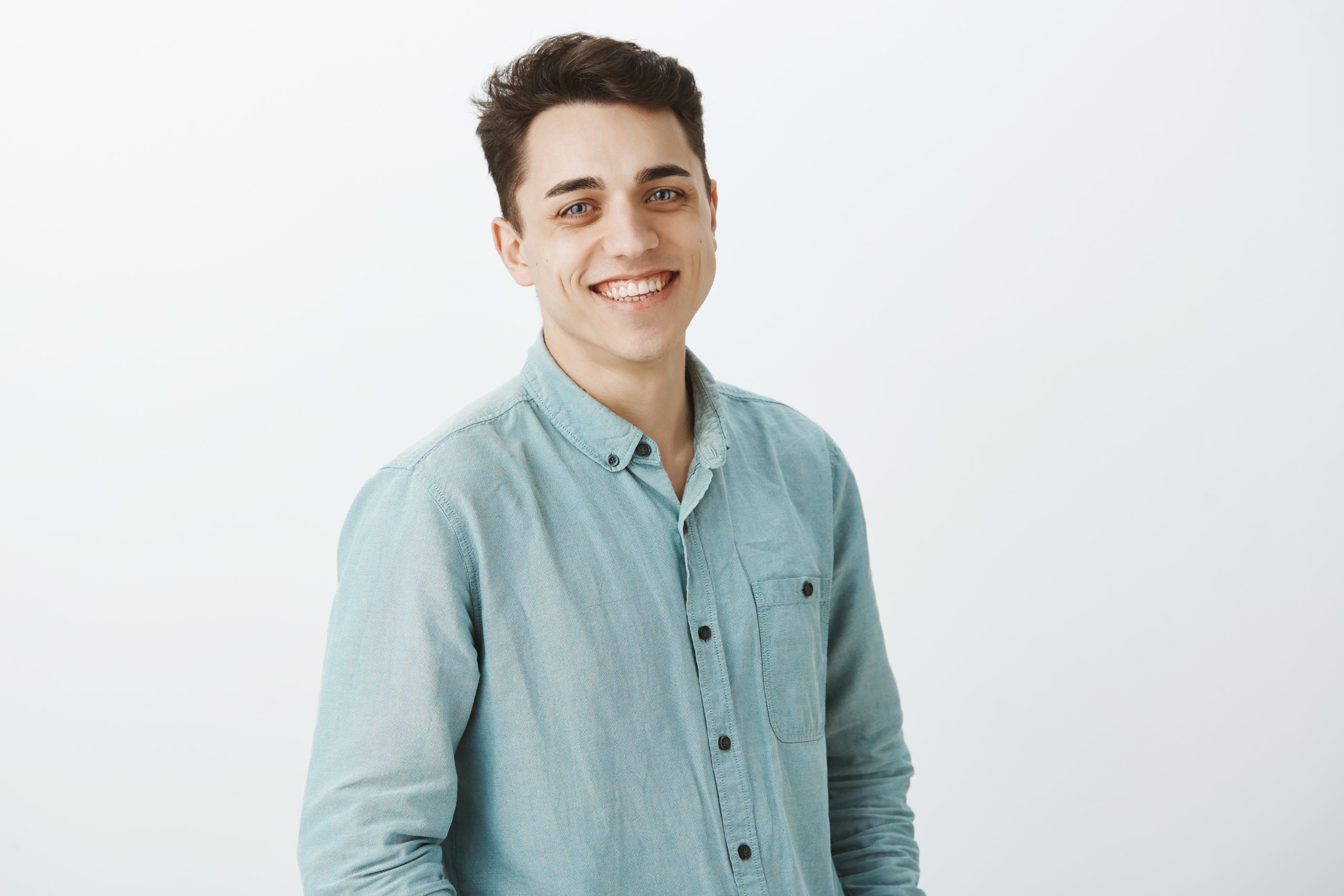 portrait good looking friendly brother standing half turned smiling broadly scaled